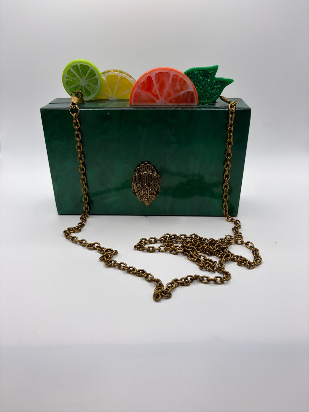 Kurt Geiger London Fruit Slice Clutch in Green with chain Crossbody strap